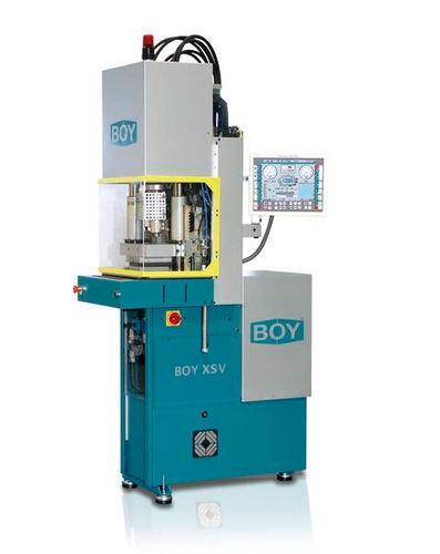 vertical injection molding machine / hydraulic / two-platen / for parts with insert