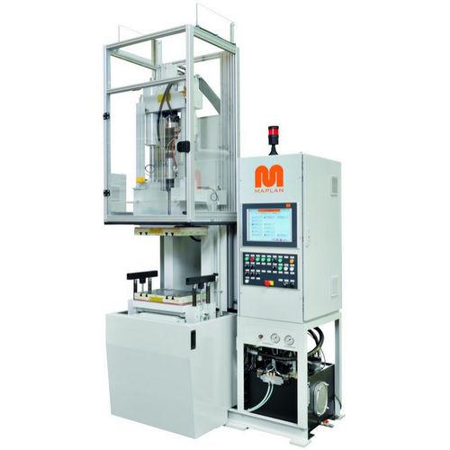 vertical injection molding machine / hydraulic / for elastomers / tie-bar-less