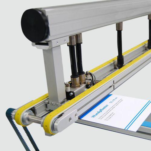 belt conveyor / overhead / suction / compact